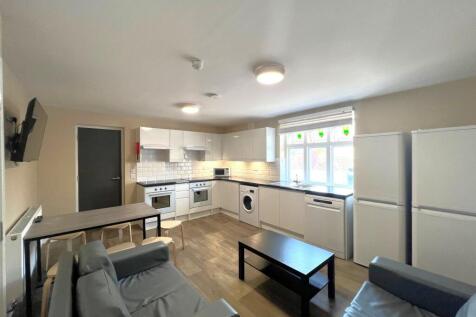 Bright, open-plan lounge and kitchen with moder...