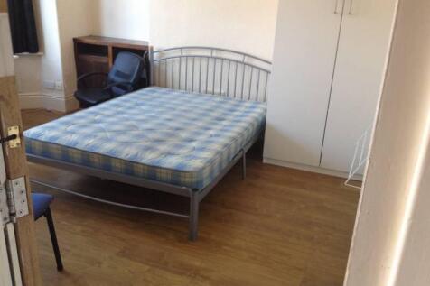 Bright bedroom with double bed and ample storag...