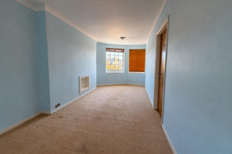 Serene Blue Hallway with Bay Windows.png