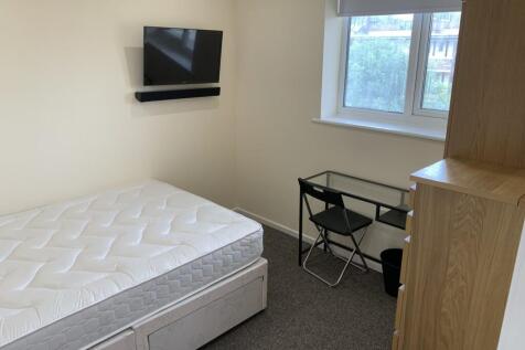 A bright and inviting double bedroom featuring ...