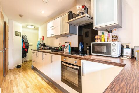 Modern kitchen with sleek units and appliances...