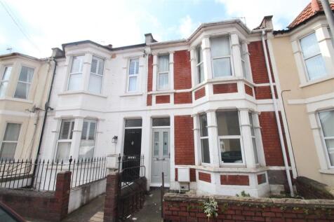 Attractive red-brick and white-painted terraced...