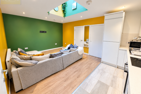 Modern Green and Gold Open-Plan Interior