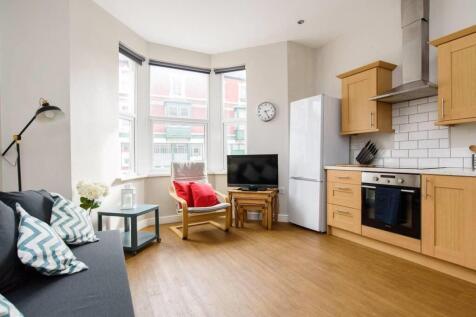 Bright modern kitchen with a bay window lounge...