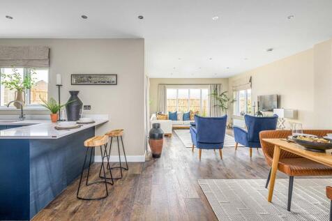 The open plan kitchen diner with garden room is the hub of this home