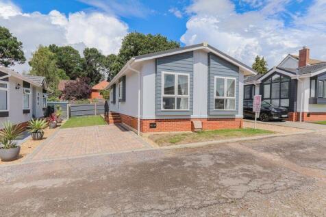 Front of Property with Paved Parking ...