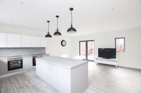 Modern, bright living room featuring large wind...