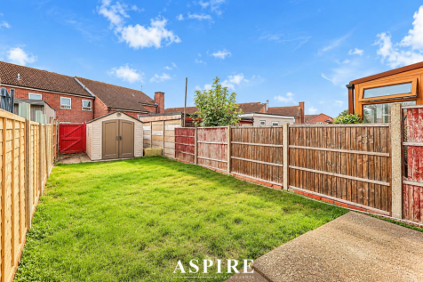 Sunny Suburban Garden with Shed.png