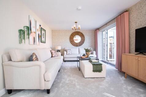 The light and spacious lounge features double doors to the garden