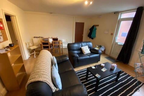 A cozy and inviting living room featuring comfo...