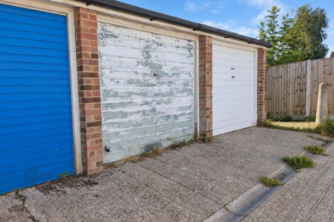 Sunny Row of Garage Doors.png