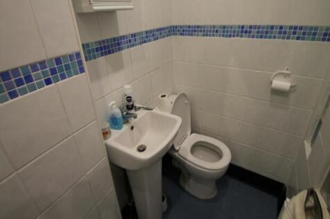 A clean, well-maintained bathroom featuring a t...