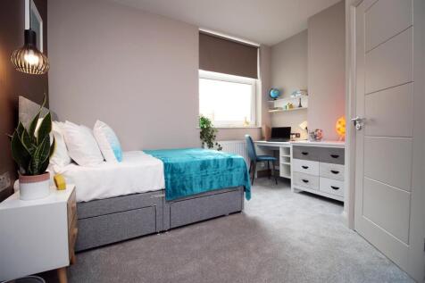 Bright modern bedroom with dedicated study desk...