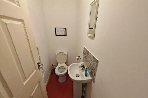 Clean and practical guest cloakroom...