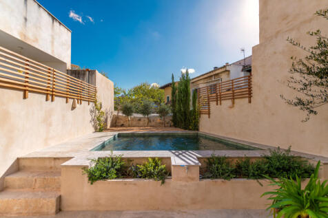Peaceful Mediterranean patio with private pool and curated planting