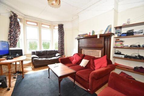 Bright, well-appointed living room with a large...