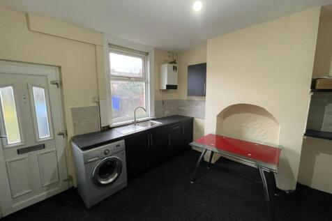Bright kitchen with modern units and dining spa...