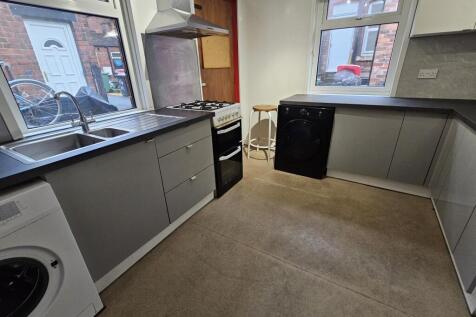 A functional kitchen space with ample counter s...