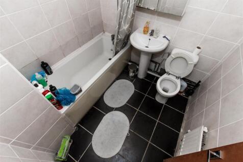 Bright bathroom with a full-size bathtub...