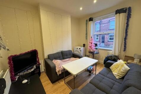 Cozy social space with comfortable grey sofas...