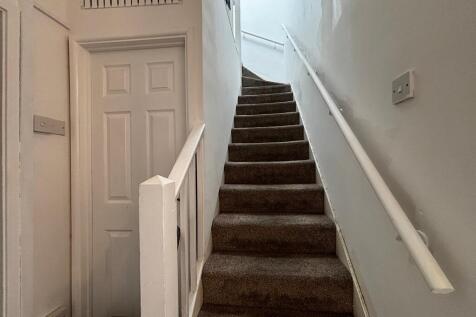 Clean and neat staircase with soft carpet...