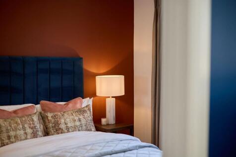 a bed with a lamp on it
