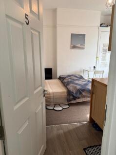 Bright bedroom with double bed and desk area...