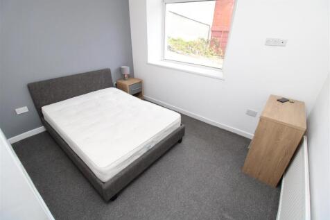 Bright modern bedroom with stylish double bed...