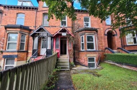 A charming historic brick building with a welco...