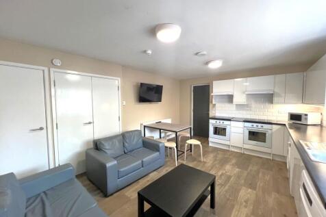 Bright open-plan living area with a modern fitt...