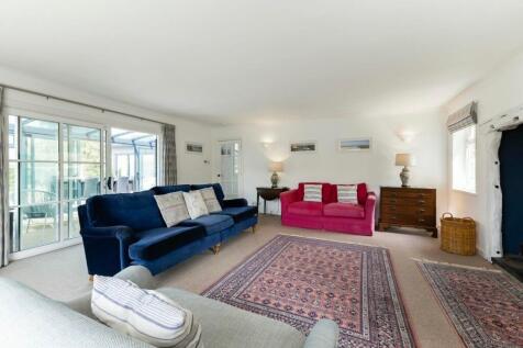 Bright lounge opening onto the garden room