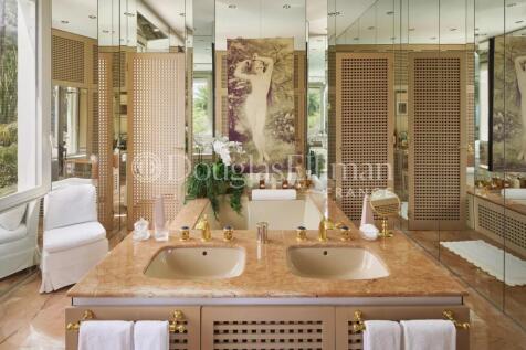 Luxurious bathroom with dual sinks, marble counter