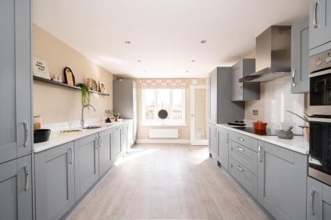 The modern kitchen offers plenty of worktop and storage space