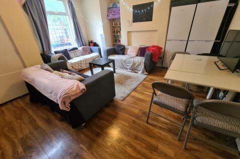 Bright and welcoming living room featuring comf...