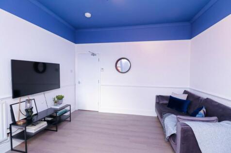 A spacious and inviting modern living room with...