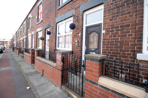 Mid terrace with a gated entrance
