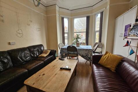 Bright, welcoming living room with bay window, ...