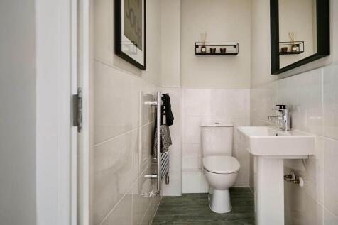 A guest cloakroom completes the ground floor