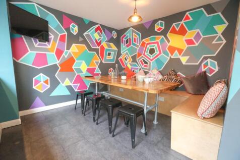 A vibrant and stylish living room with a geomet...