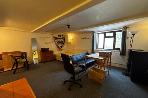 Spacious bedroom with versatile living area...