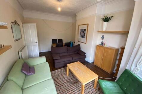 A bright and welcoming living room with comfort...