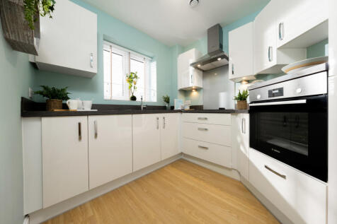 a kitchen with white cabinets