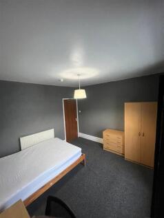 Spacious modern bedroom with ample storage...