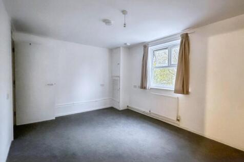 Bright, spacious room with clean white walls...