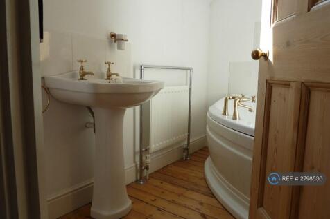 Large Bathroom With Shower Over Bath
