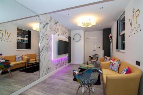 Stylish lounge with marble wall and neon lighti...