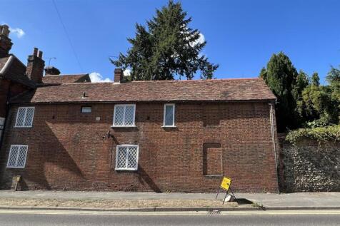 Charming brick-front property on a sunny street...