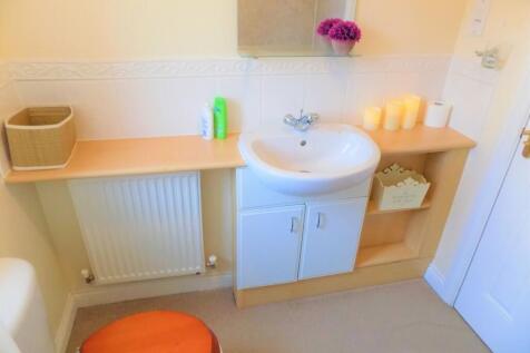 A neat and well-maintained bathroom featuring a...