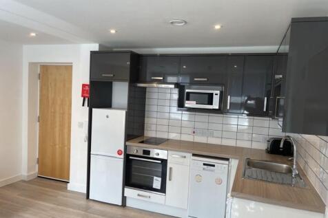 Modern gloss kitchen with high-end appliances...