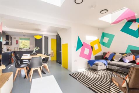 Bright open-plan living area with modern decor...